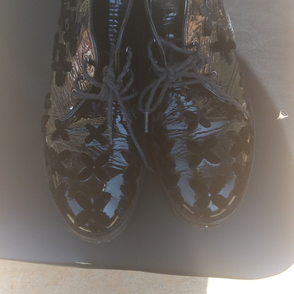 ALAIA PATENT LEATHER FLORAL BOOTIES